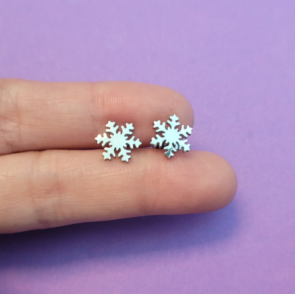 Set of cool snowflake silver stainless steel stud earrings. Hypoallergenic